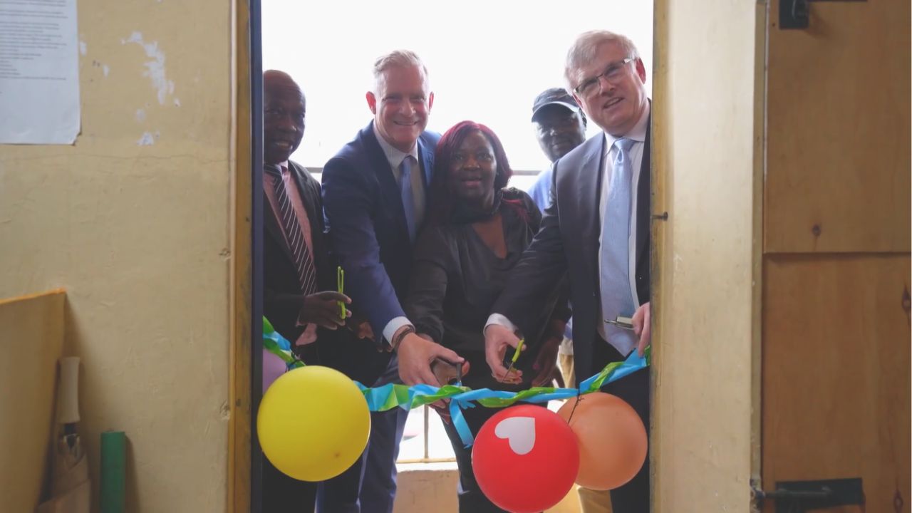Delegates from Kenya and leaders from SMART and N50 join to cut the ribbon on the inauguration of The Excellence Schools new technology lab.
