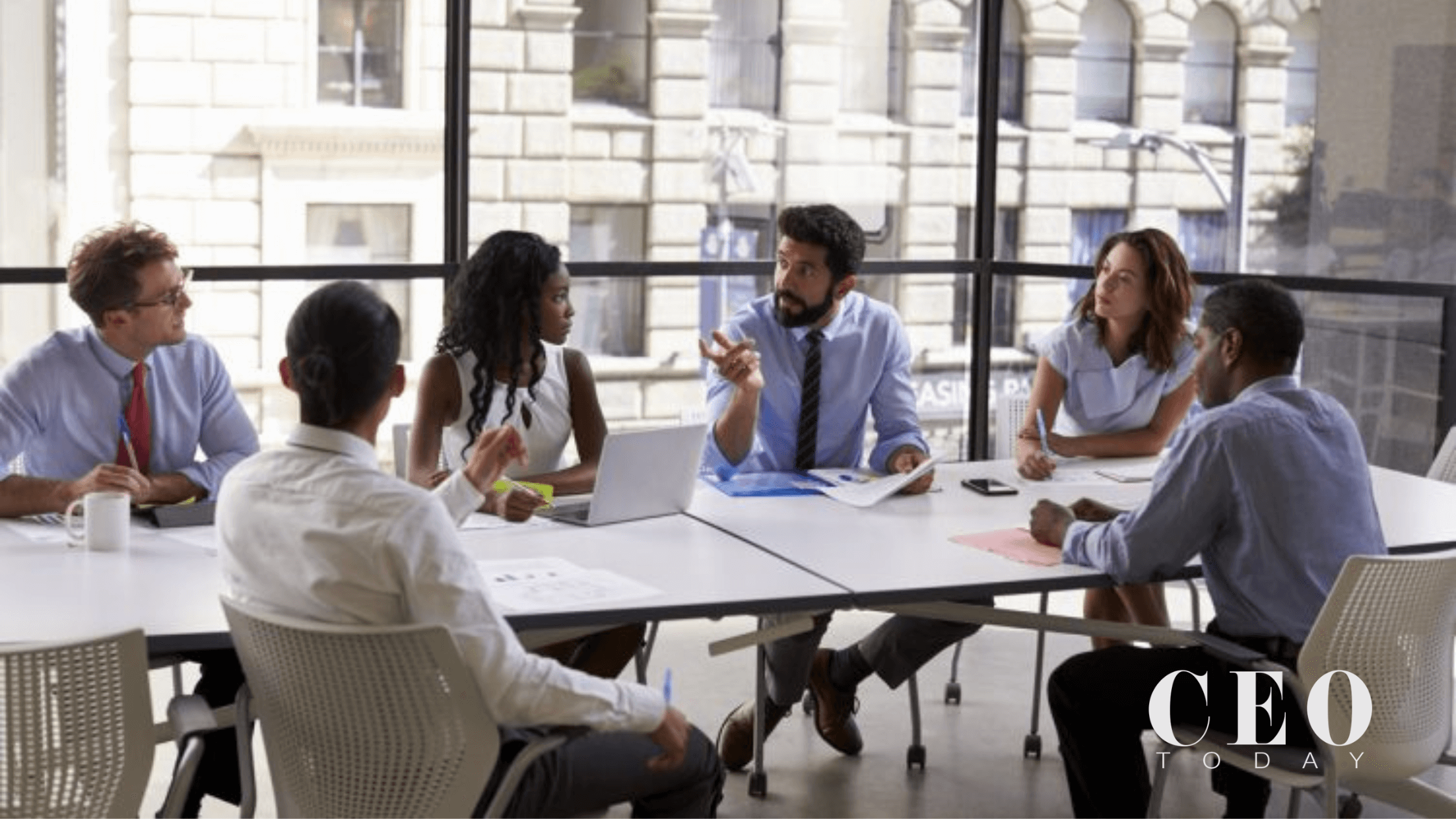A group of professionals collaborating during a corporate training session