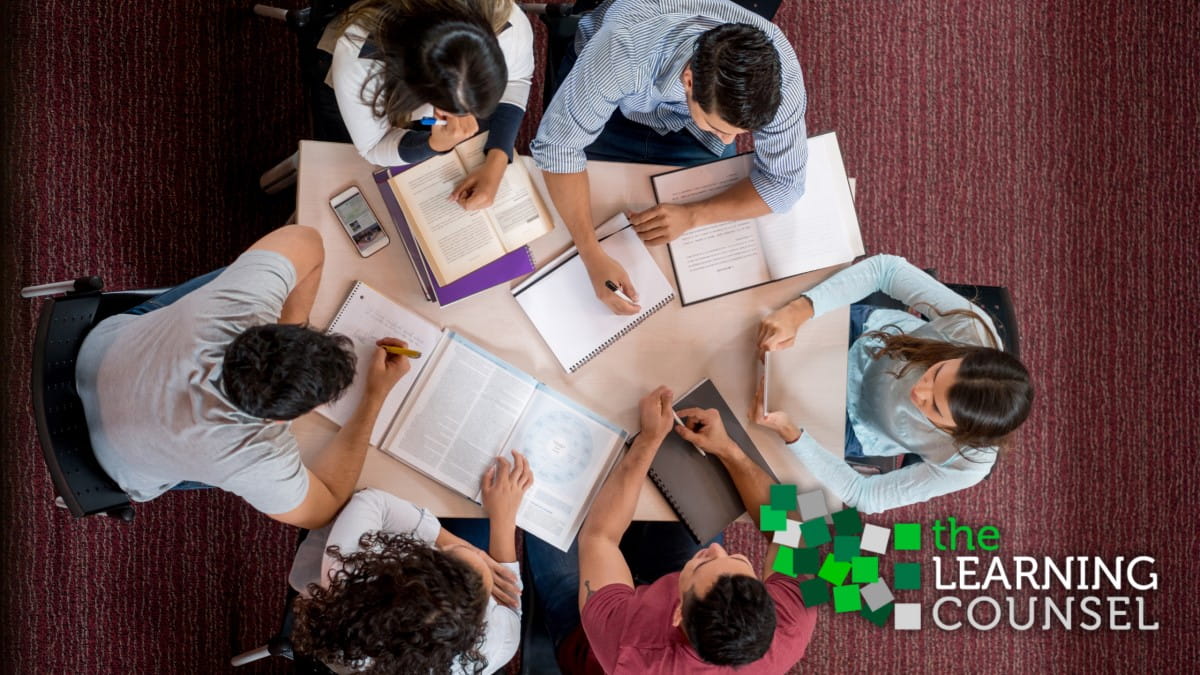 Education leaders gathered at a table to collaborate.