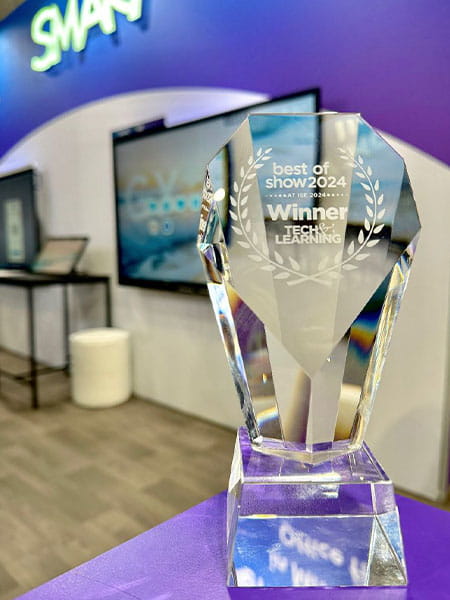 Crystal trophy for 'Best of Show 2024' by Tech & Learning, awarded to SMART at the Integrated Systems Europe event, displayed in front of SMART's exhibit.