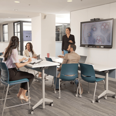 A group of professionals collaborating during a corporate training session