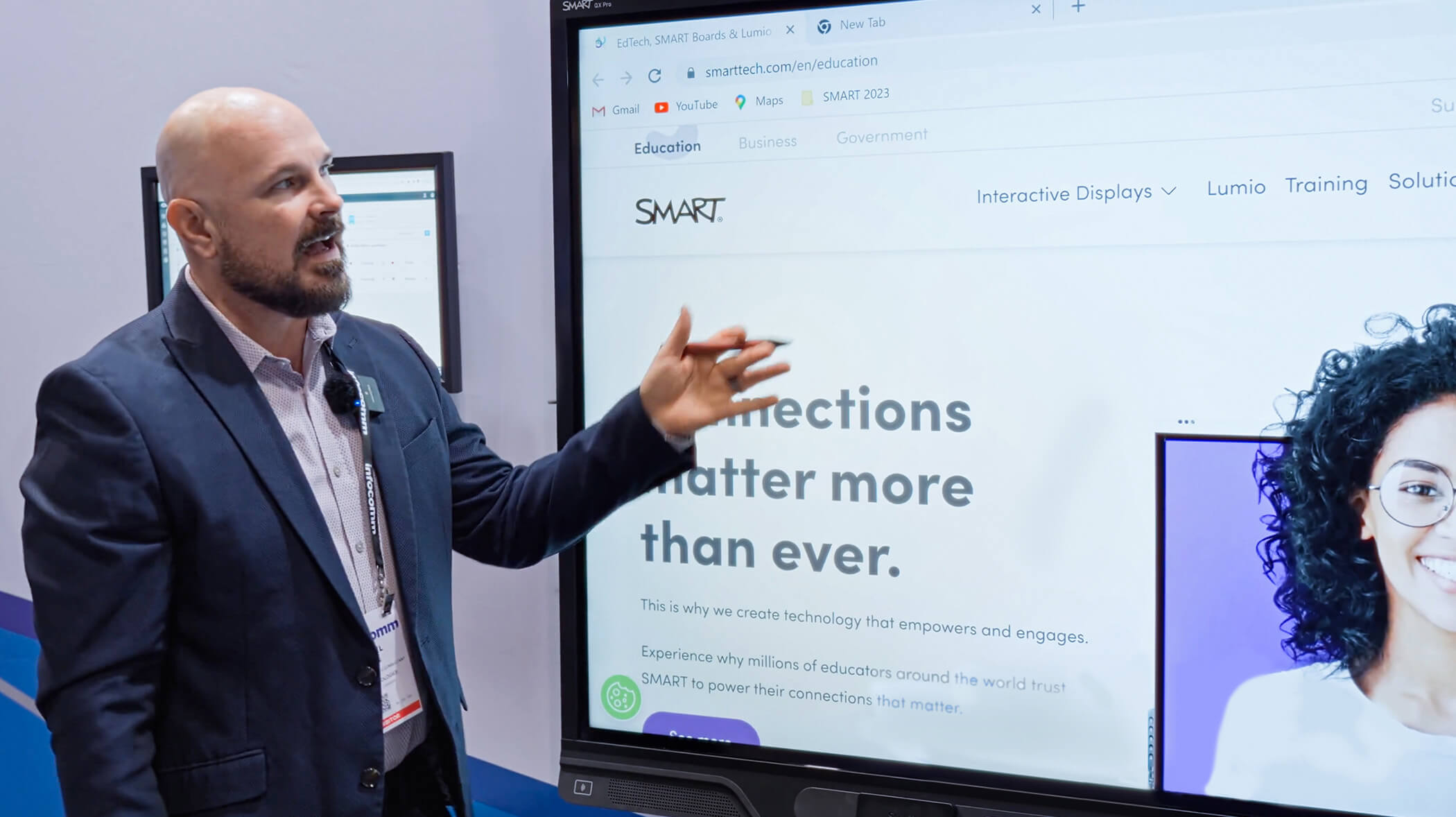 Michael showcasing the features and benefits of a SMART interactive display through a demo.