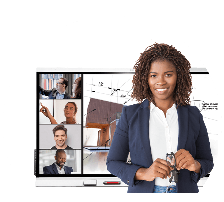 Confident businesswoman standing in front of a SMART Board showing a video conference with multiple participants.