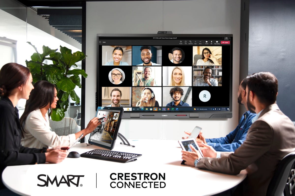 Team engaging in a digital meeting using a SMART interactive display with Crestron connectivity in a conference room.