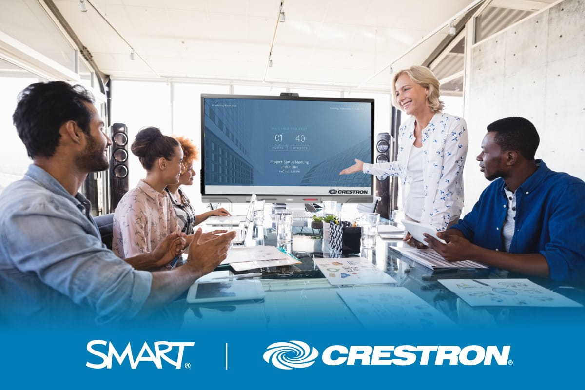 Business meeting with SMART interactive display certified for Crestron XiO Cloud, showcasing collaboration and efficiency.