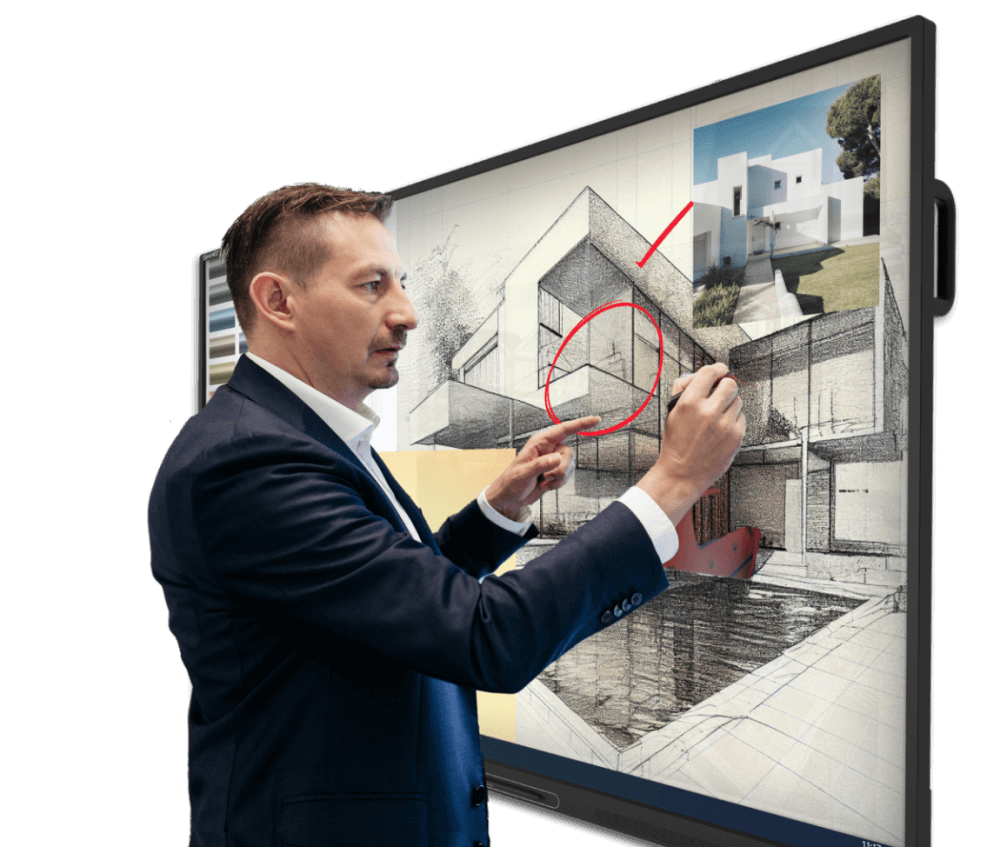 A business professional in a suit highlighting features on an architectural design displayed on a SMART Board.
