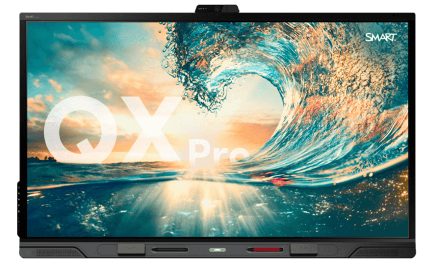 QX Pro SMART Board for business meetings, featuring a vibrant image of a cresting ocean wave under a sunset, symbolizing dynamic and powerful business solutions.