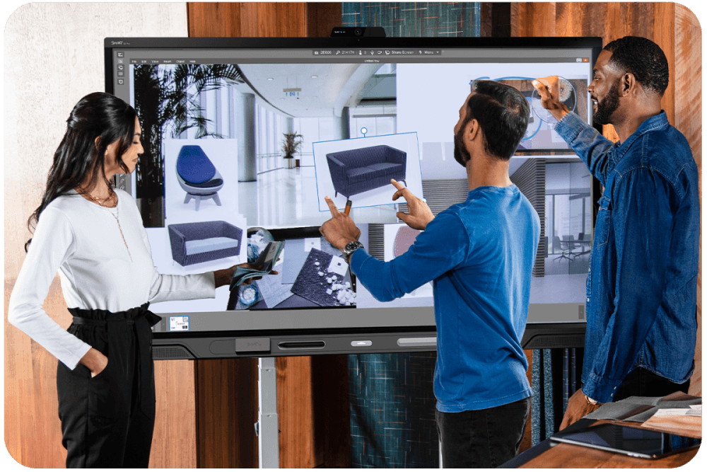 Team of professionals engaging with QX Pro series interactive display
