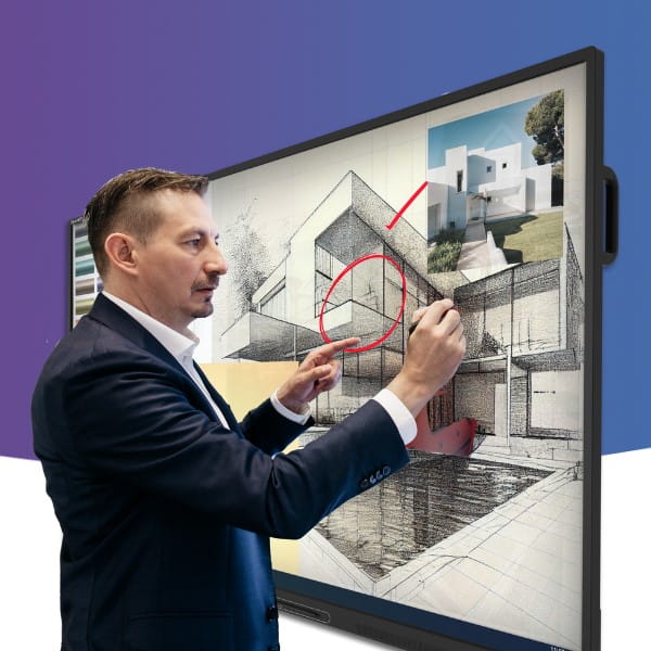 A professional annotating on a building design using the SMART Board GX Series.
