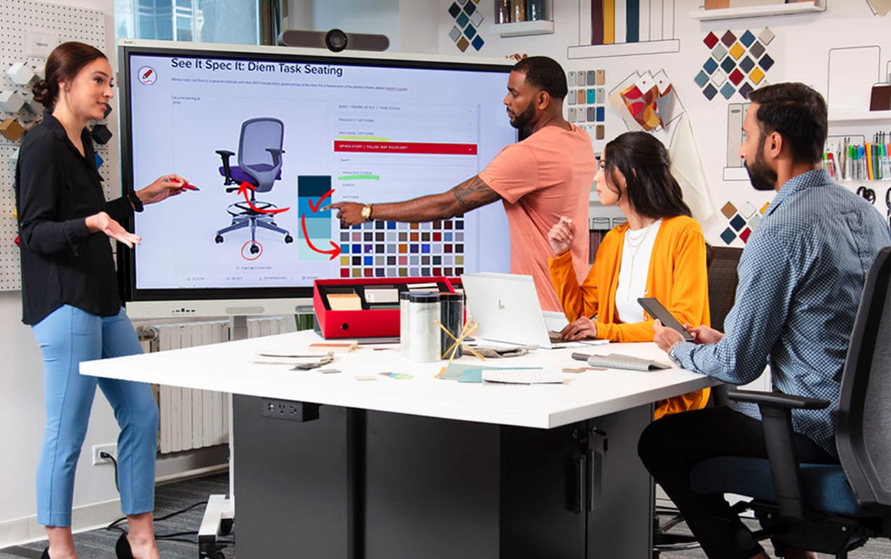 Group of small business owners collaborating on an MX Pro SMART board