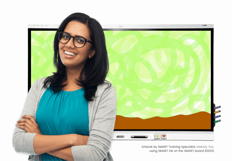 A woman standing in front of a SMART Board for education