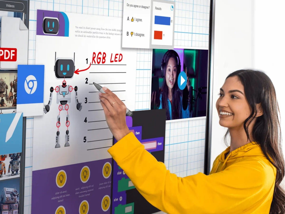 Teacher and student interactively engaging with educational content on a SMART Board RX series displaying colorful programming blocks and a smiling robot graphic.