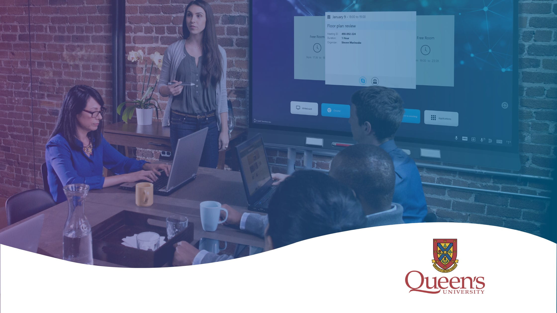 A team of researchers collaborating infront of a SMART Board. There is an opaque purple and blue screen above the image and the Queens University logo sits in the bottom right corner of the image.