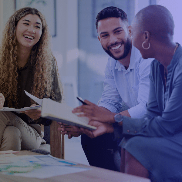 Three professionals engaging in an informal chat at work provided by SMART and Xerox Business Solutions Midwest.