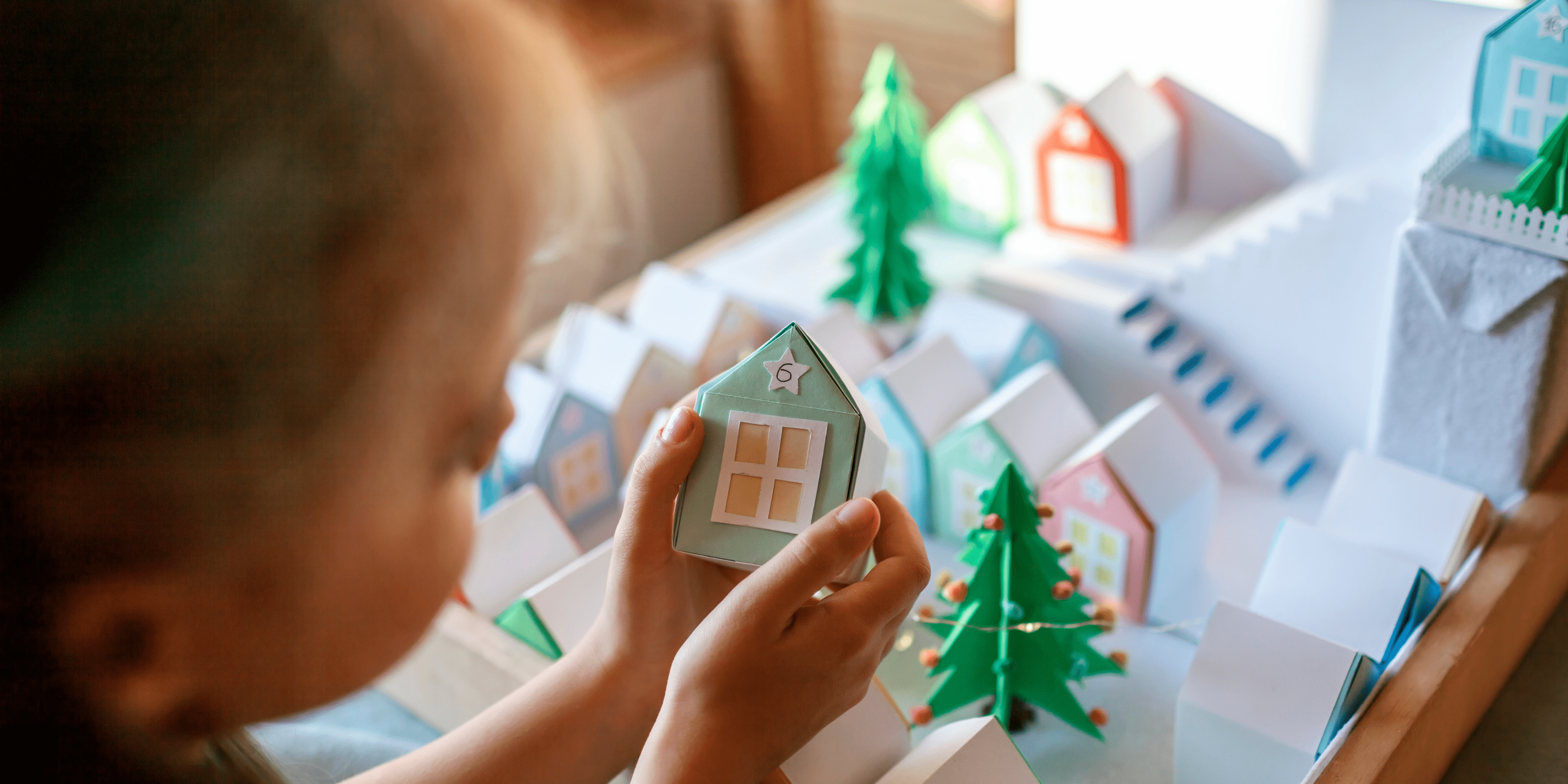 A student making a winter-themed diorama.