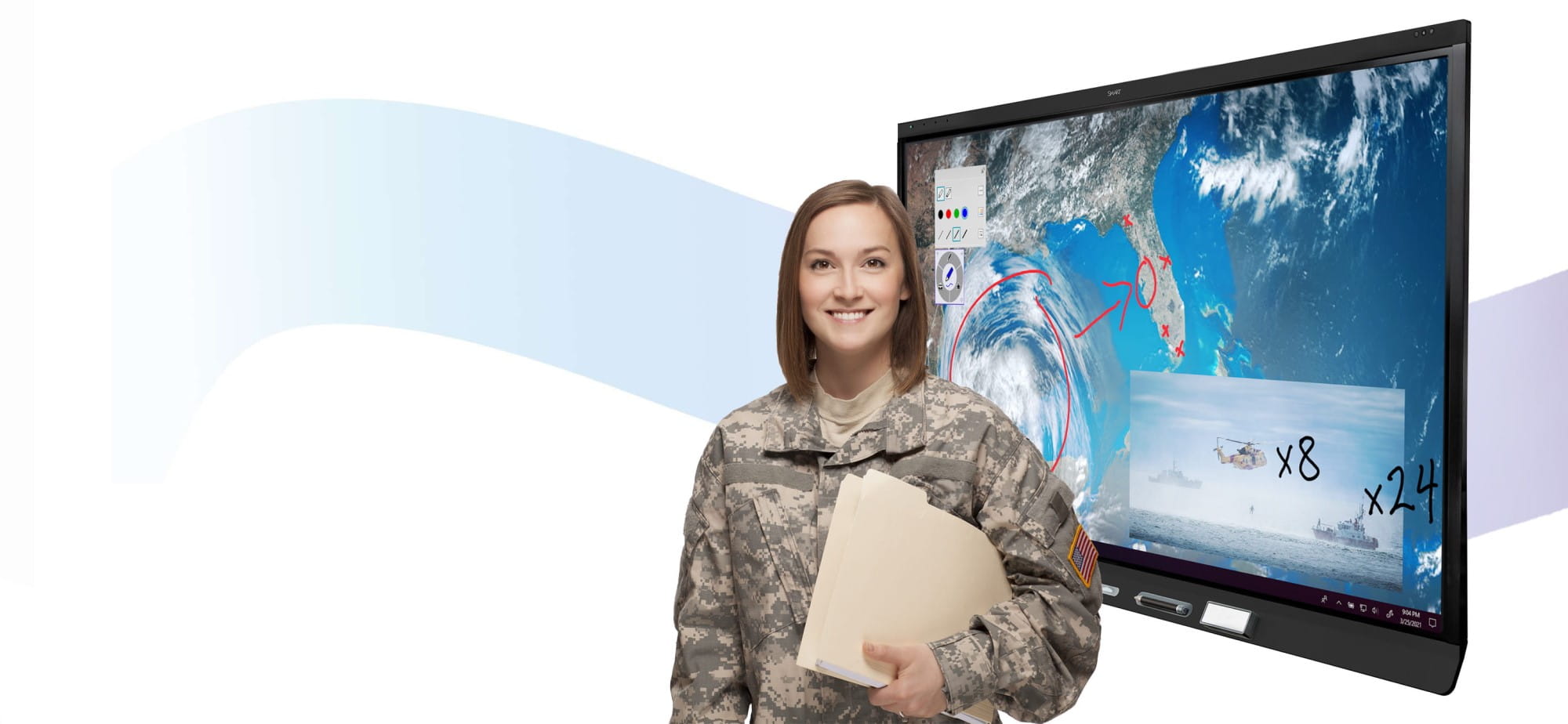 Woman in military uniform holding a folder stands beside a SMART interactive display showcasing satellite imagery of a cyclone, with various annotations and smaller images, including helicopters and ships.