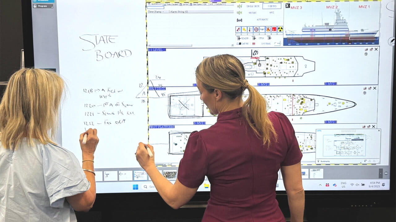 Government team collaborating on operational data and decision support information using an interactive display.