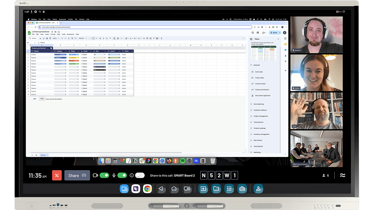 SMART Board interactive display running Google Sheets and SMART TeamWorks software with remote participants collaborating in a video conference.