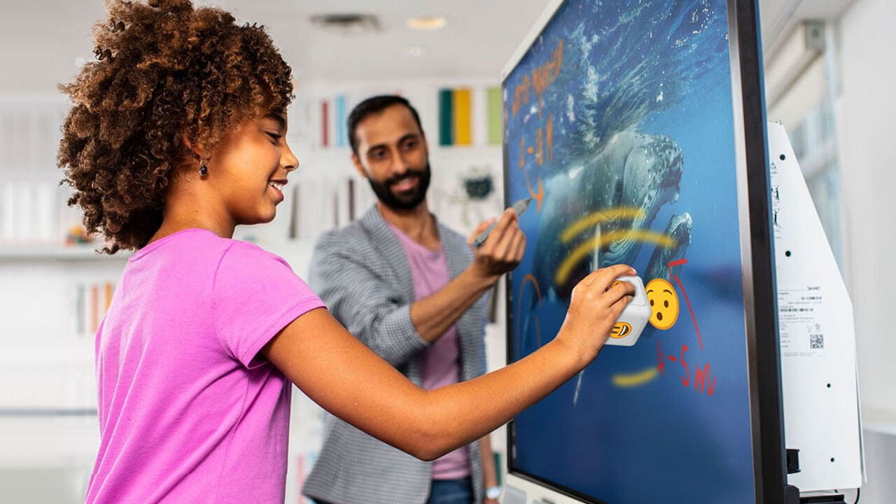 Student using tool explorer cube on a SMART Board.