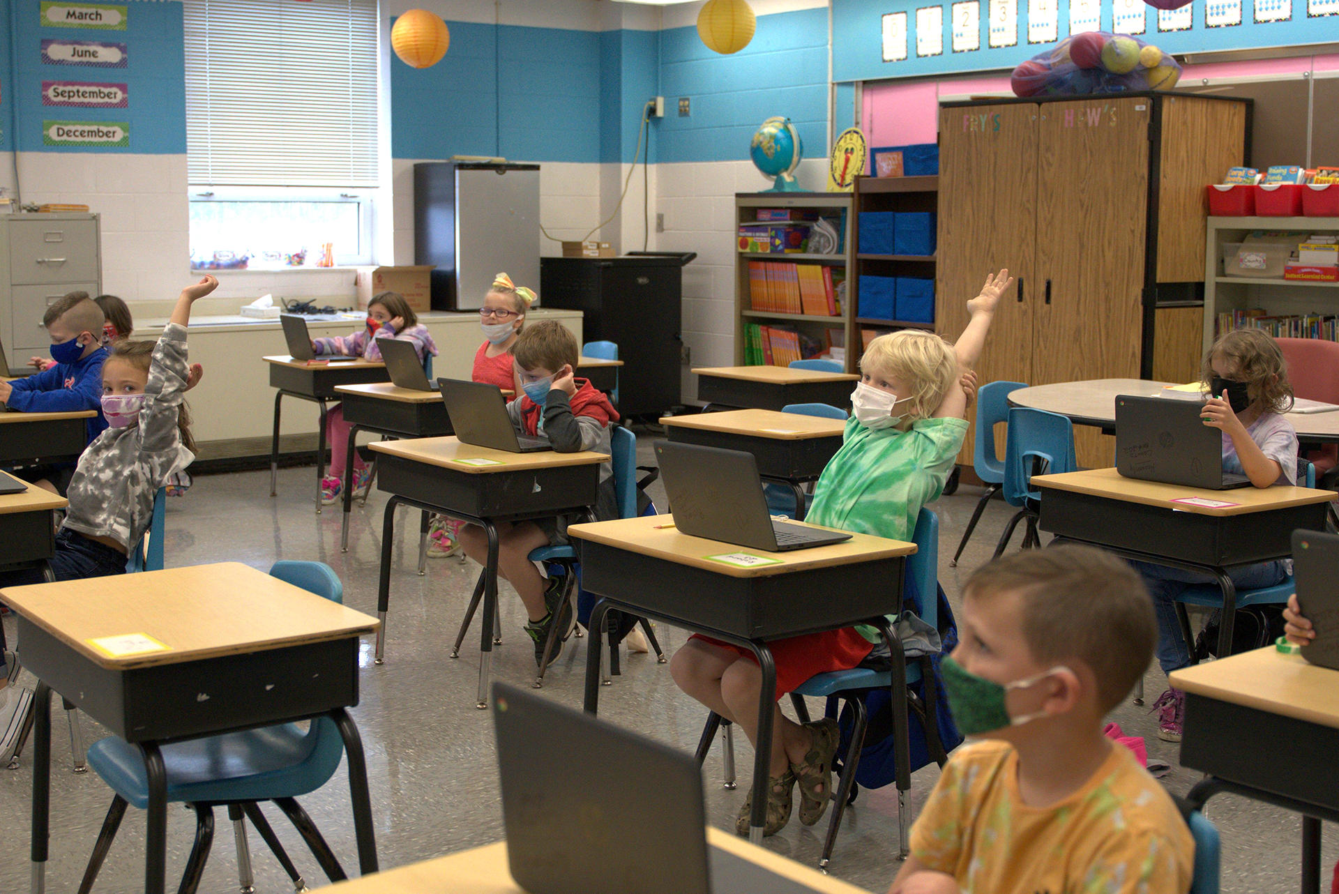 Students participate in a lesson while on their personal devices.