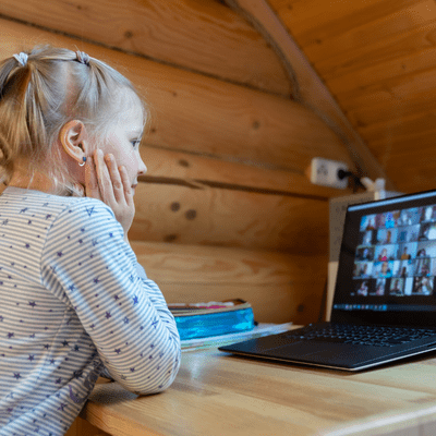 A student interacts with her classmates during a remote learning lesson.