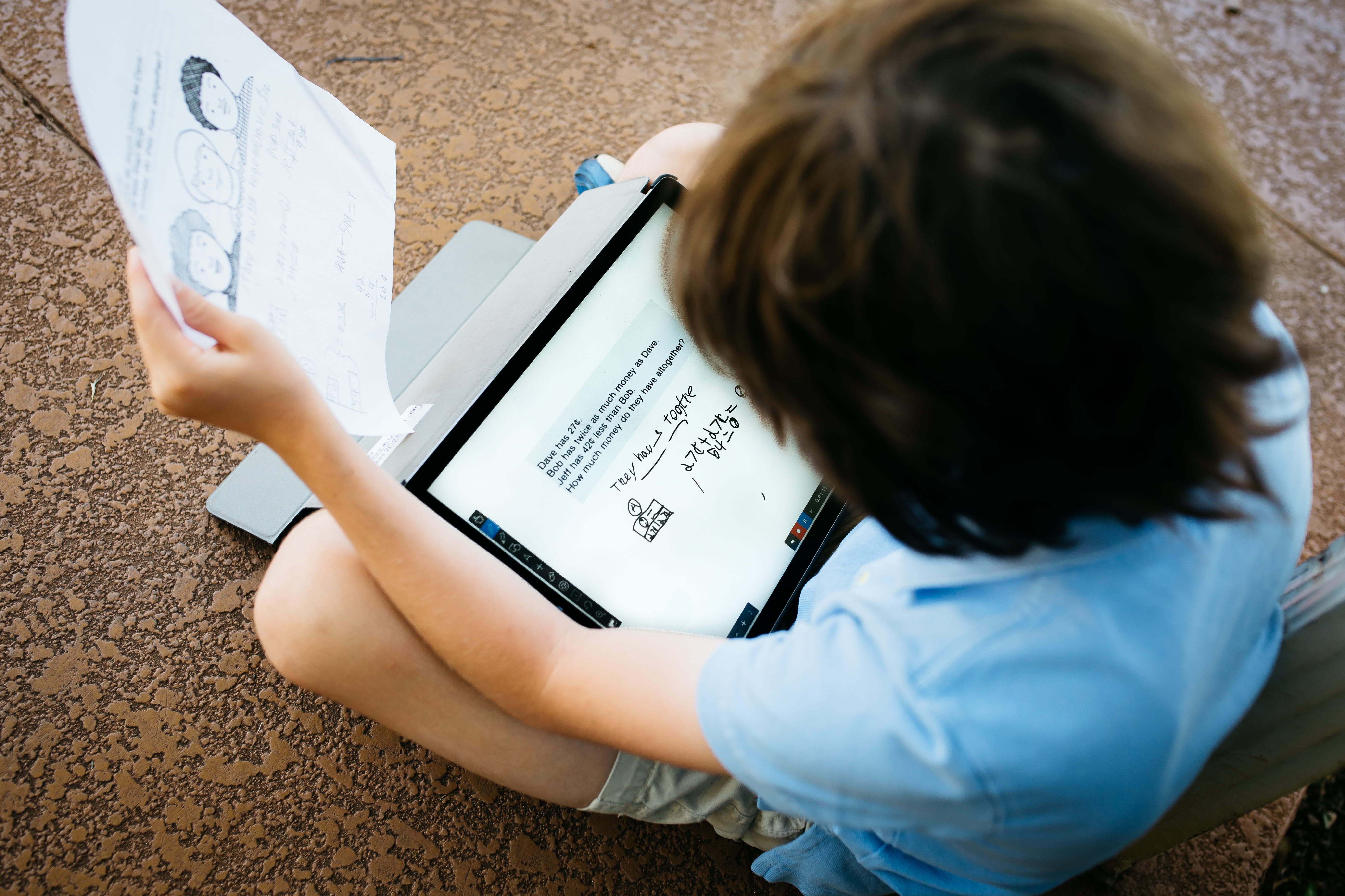 A student completes an assignment on his personal learning device. A student completes an assignment on his personal learning device.