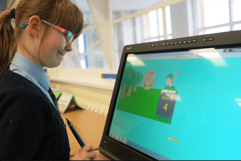 A student engages with a Lumio lesson on her tablet at a SMART Exemplary School.