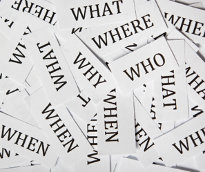 White cards with the words "Who, what, where, when, why"