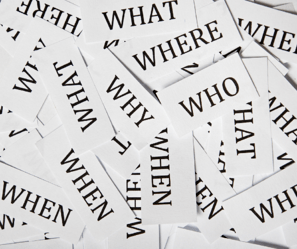 White cards with the words "Who, what, where, when, why"