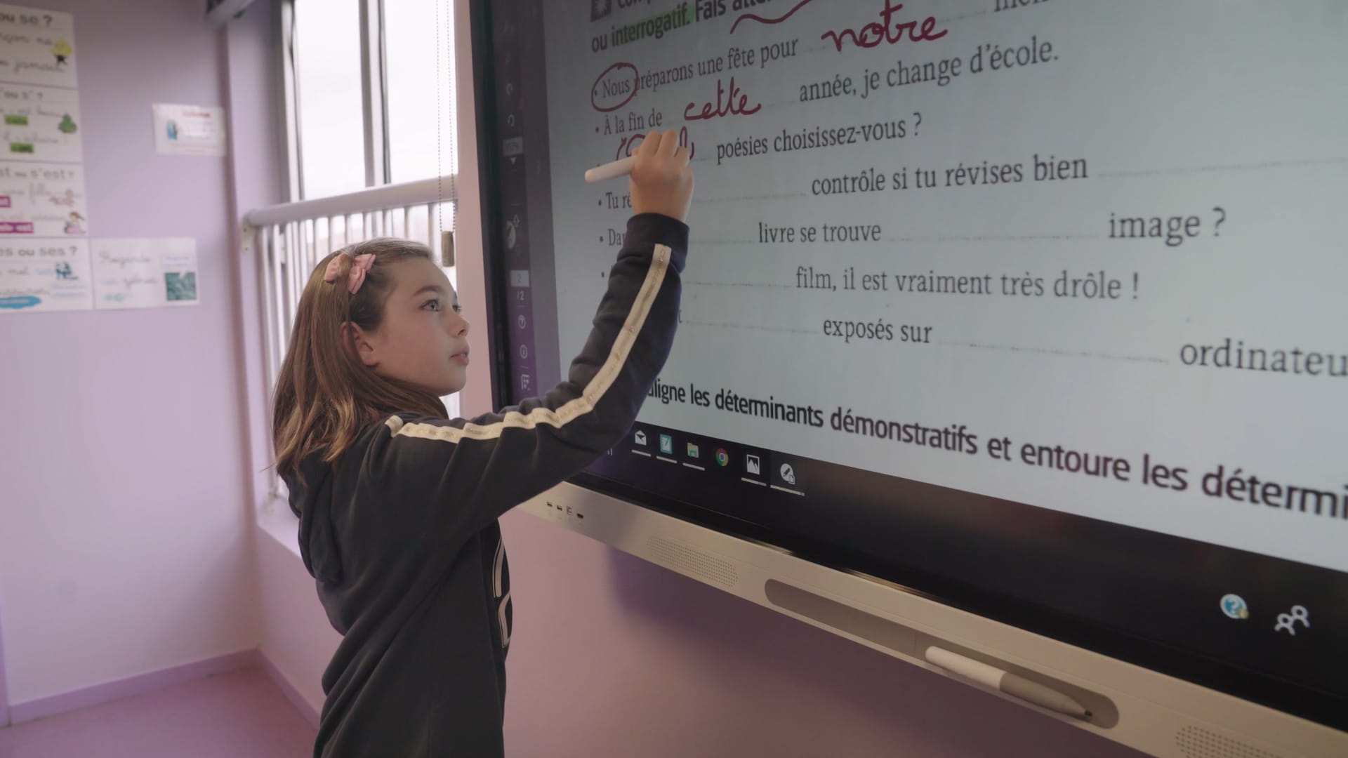 Student working on a SMART board