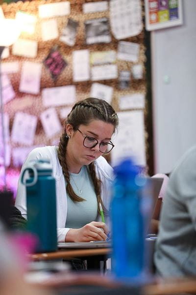 Female student learning in class