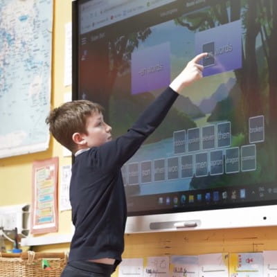 A student engaging with Lumio software on a SMART Display.