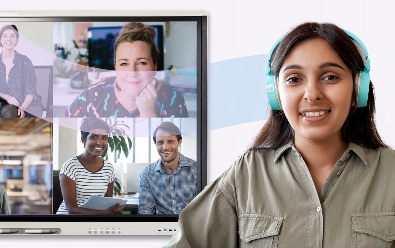 A woman with headphones participates in a virtual meeting with colleagues on a SMART Interactive display, exemplifying effective remote communication.