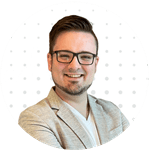 Chad Visser smiling in a professional headshot with a white polka-dot background.