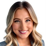 Headshot of Michelle Grindberg with a bright smile and professional look.