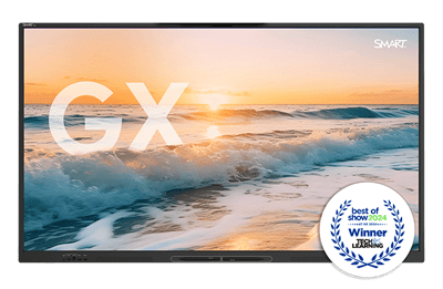 The GX-V3 display showcasing a stunning beach sunset, with the large letters 'GX' superimposed on the image. In the corner, a 'Best of Show 2024' award badge from Tech and Learning at the ISE event signifies the product's achievement.