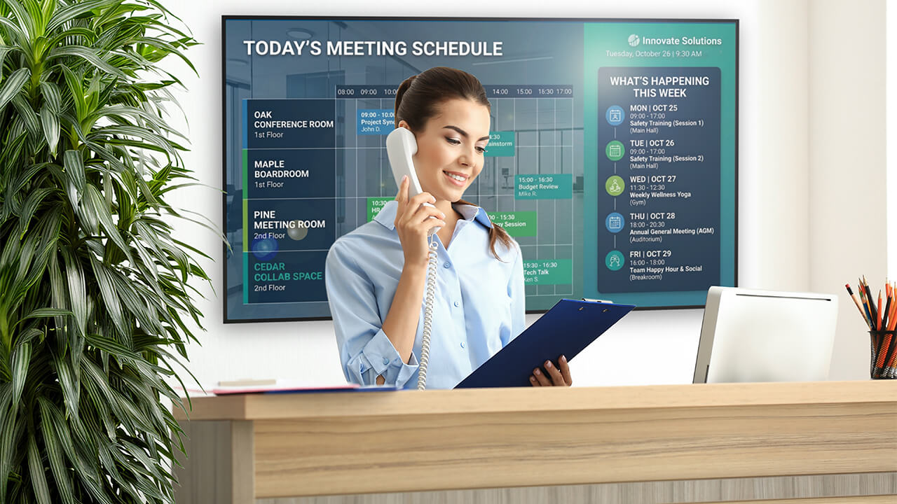 Reception area digital signage displaying meeting room schedules, events, and organizational announcements.